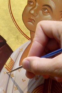 Applying finishing touches. Icon painting by John Snogren.